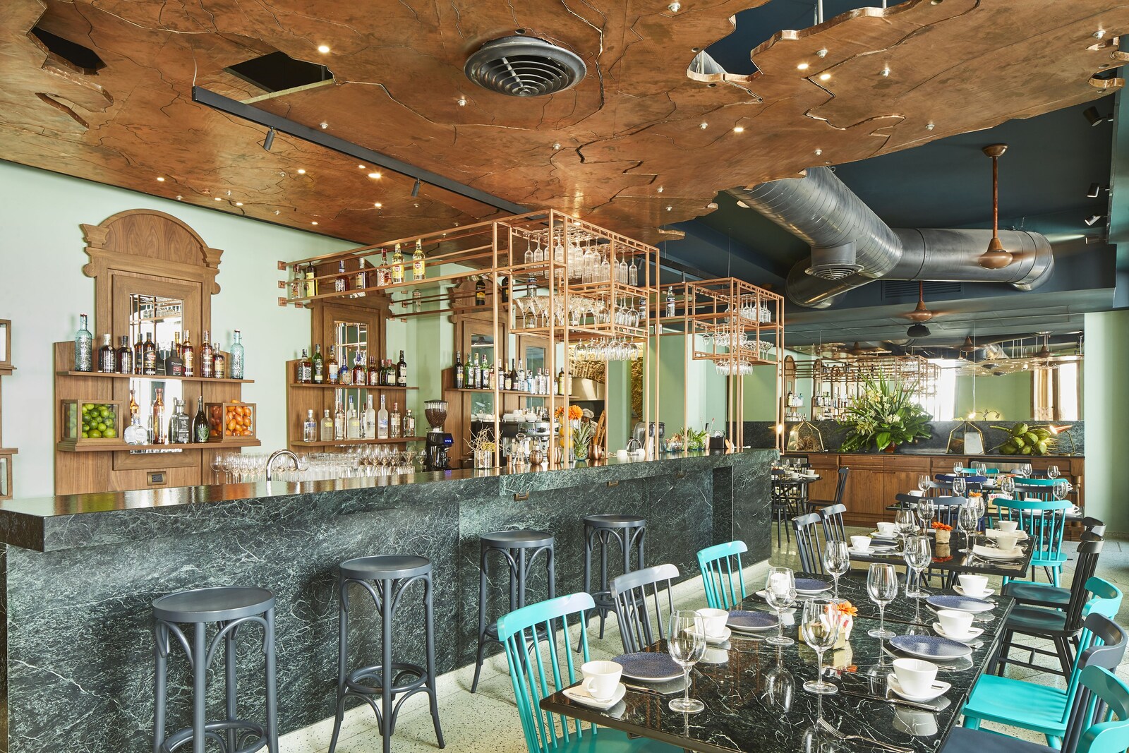 Costa Restaurante Bar with its marble bar and tables set for service